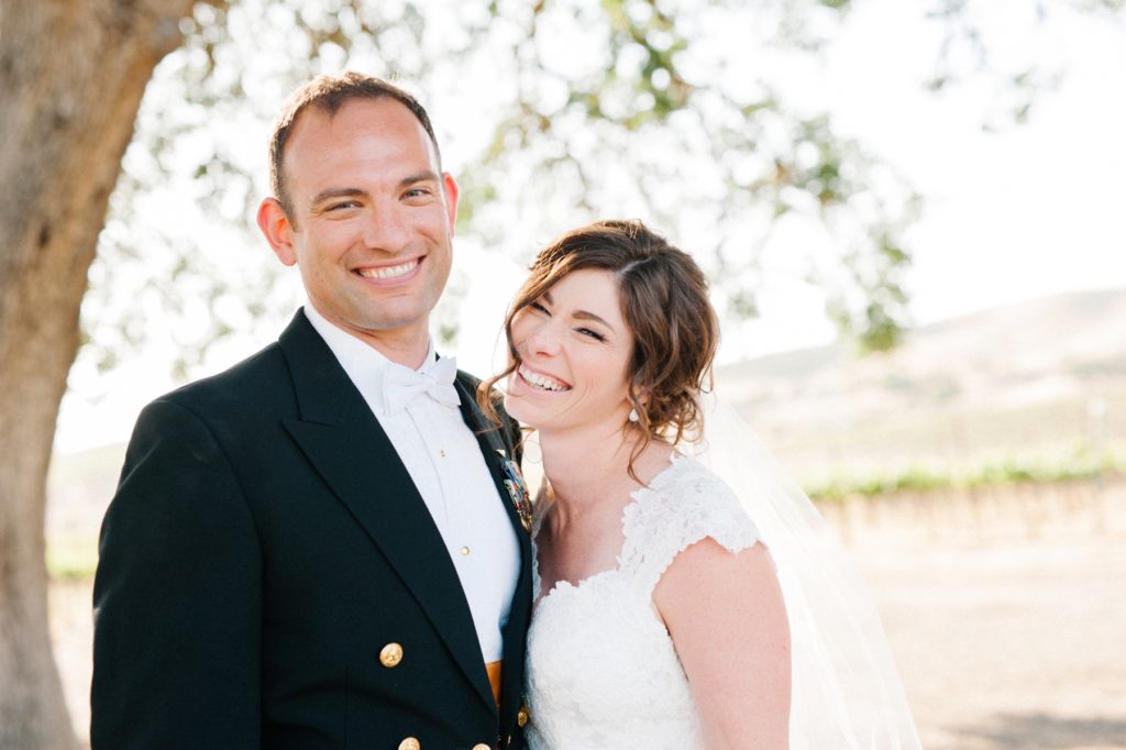 Couple laughing at Cass Winery Wedding in Paso Robles, California by Paso Robles Wedding Photographer Austyn Elizabeth Photography.