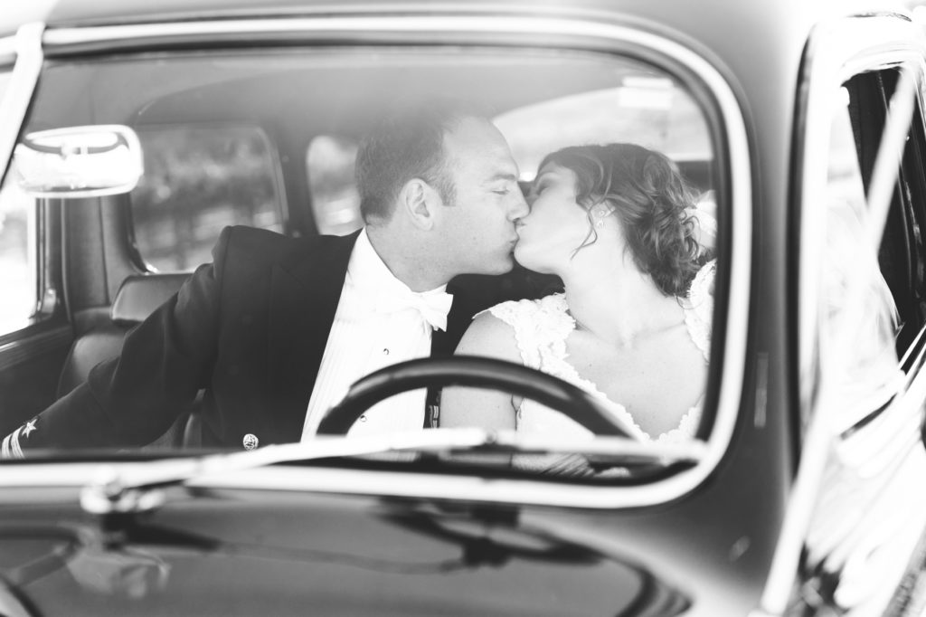 Bride and Groom kissing in Classic Chrysler Car at Cass Winery Wedding by San Luis Obispo Photographer Austyn Elizabeth Photography