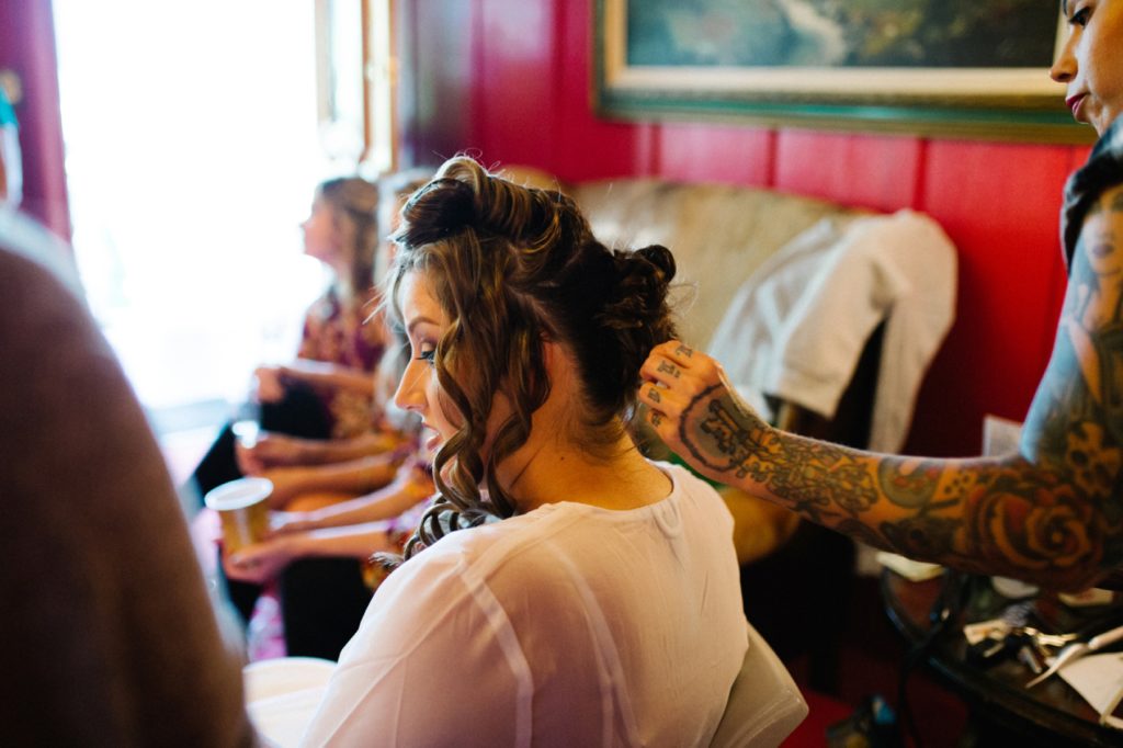 Bride getting hair done by The Wedding Beauty Collective at the Madonna Inn for Spanish Oaks Ranch Wedding with San Luis Obispo Wedding Photographers Austyn Elizabeth Photography