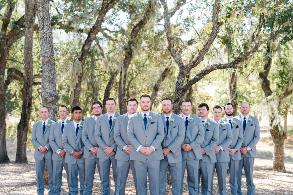 Groomsmen all lined up at Spanish Oaks Wedding by San Luis Obispo Wedding Photographers Austyn Elizabeth Photography