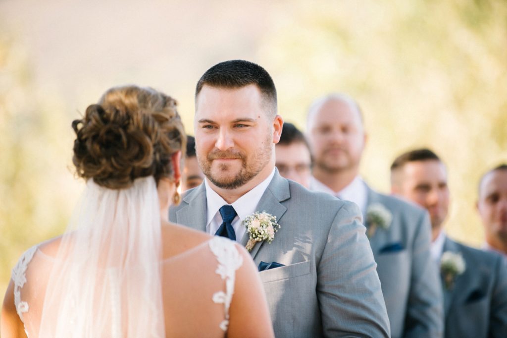 Groom looking at bride during ceremony at Spanish Oaks Wedding by San Luis Obispo Wedding Photographers Austyn Elizabeth Photography