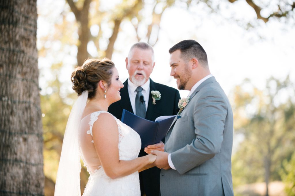 Bride and Groom during ceremony at Spanish Oaks Wedding by San Luis Obispo Wedding Photographers Austyn Elizabeth Photography
