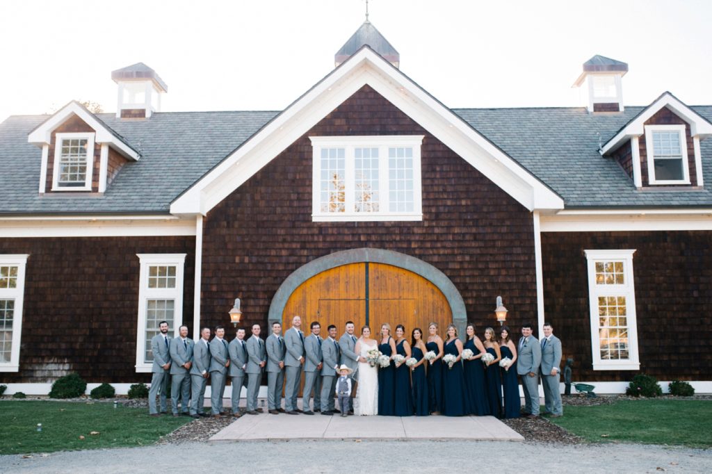 Whole wedding party in front of the barn at Spanish Oaks Wedding by San Luis Obispo Wedding Photographers Austyn Elizabeth Photography