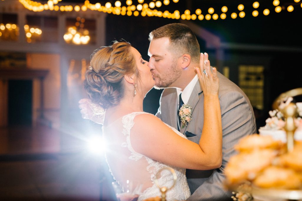 Kiss after cake cutting at Spanish Oaks Wedding by San Luis Obispo Wedding Photographers Austyn Elizabeth Photography