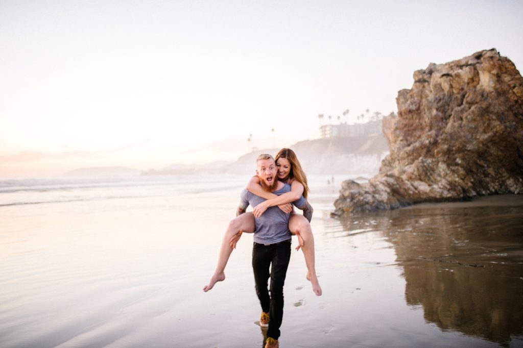 Couple at play by the cliffs in Pismo Beach with Pismo Beach wedding photographer Austyn Elizabeth Photography