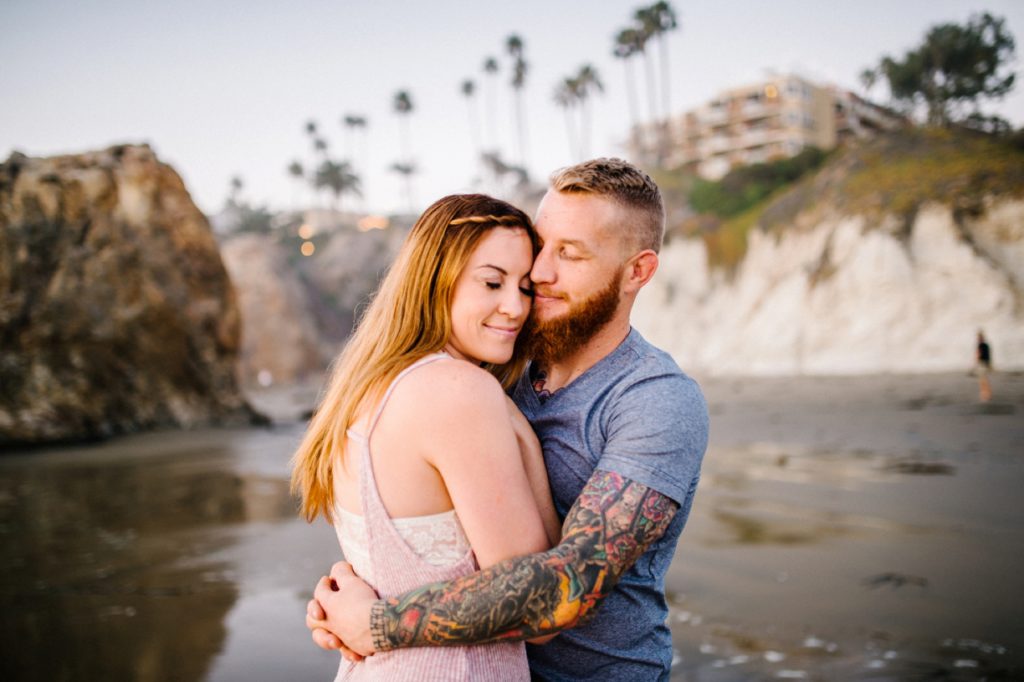 Couple at play by the cliffs in Pismo Beach with Pismo Beach wedding photographer Austyn Elizabeth Photography