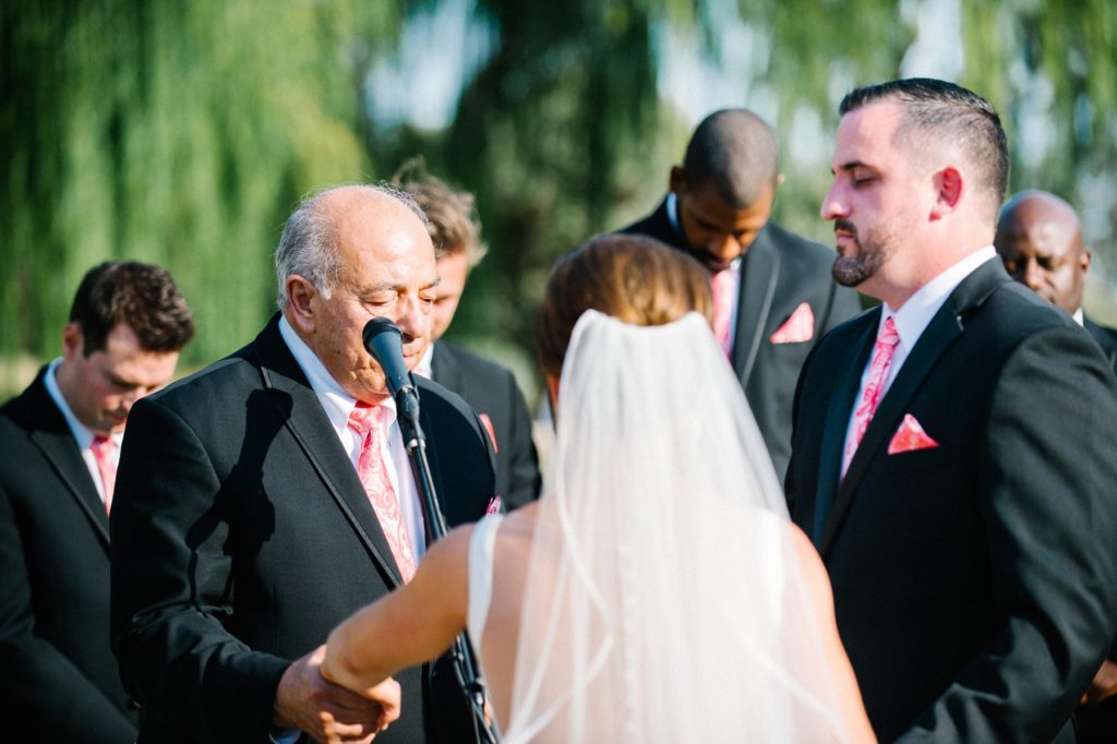 Grandfather praying at Terra Mia Wedding Ceremony in Paso Robles by Austyn Elizabeth Photography