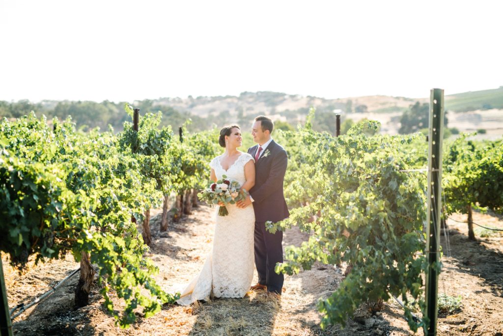 walking in the vineyards at cass winery wedding by paso robles wedding photographer Austyn Elizabeth Photography