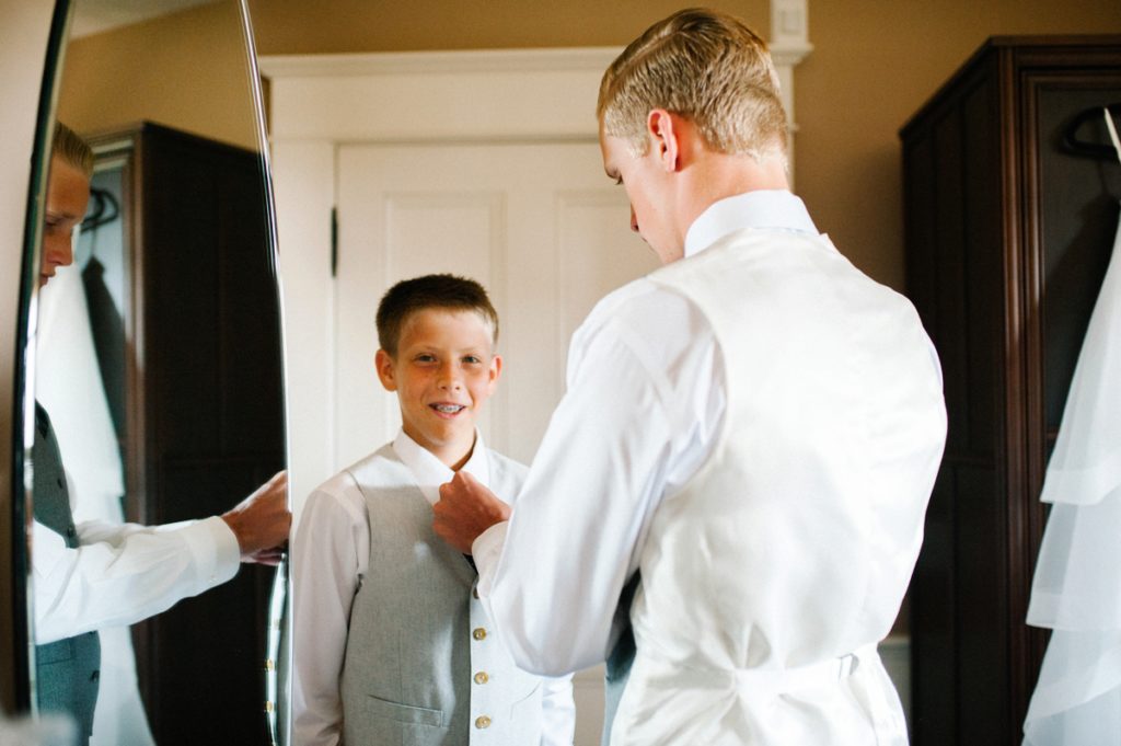 Brothers helping eachother get ready at Cass House Wedding by SLO Wedding Photographer Austyn Elizabeth Photography