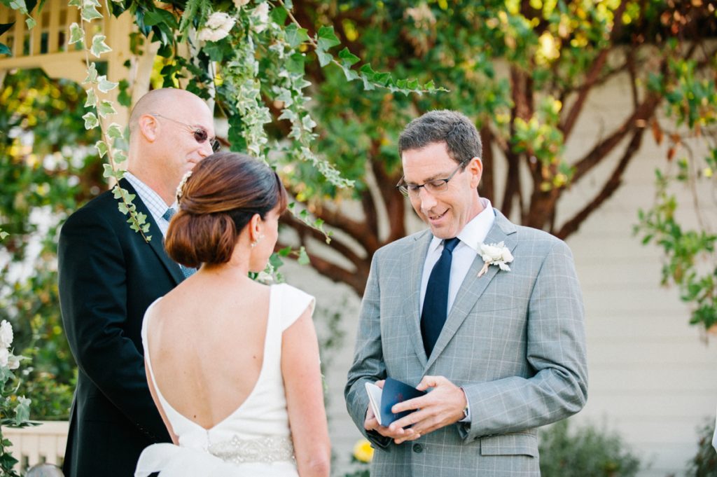 Groom says vows at Cass House Wedding by Pacific Ocean by Austyn Elizabeth