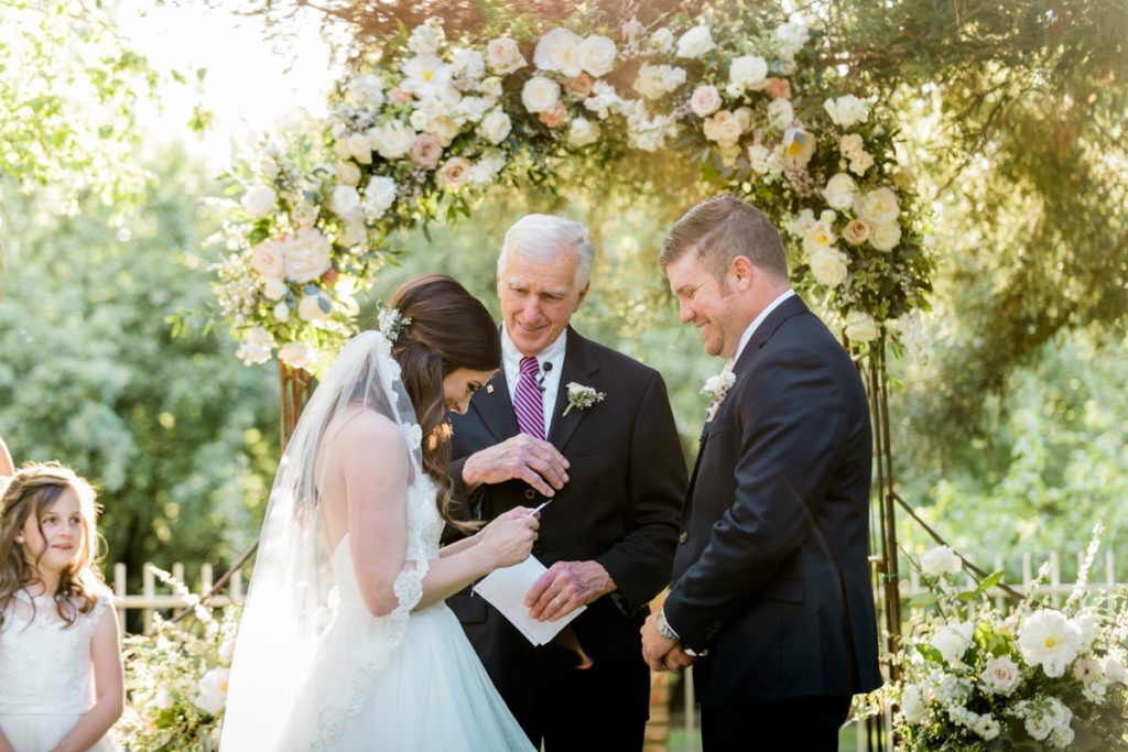 laughing during wedding ceremony at at Almond Grove Wedding by Paso Robles Wedding Photographer Austyn Elizabeth Ford