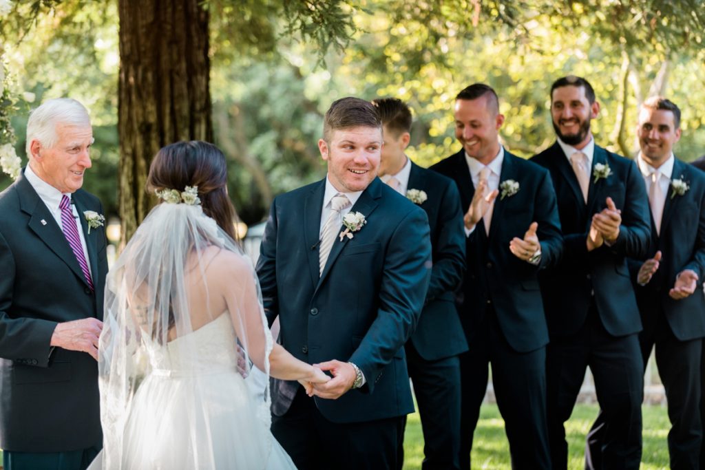 Groom at wedding ceremony at at Almond Grove Wedding by Paso Robles Wedding Photographer Austyn Elizabeth Ford