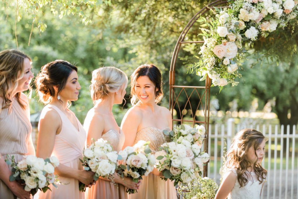 bridesmaids giggling at at Almond Grove Wedding by Paso Robles Wedding Photographer Austyn Elizabeth Ford