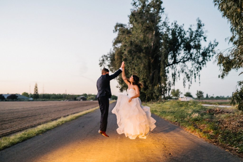 Bride and groom give highfive at sunset by SLO Wedding Photographers Austyn Elizabeth Photography