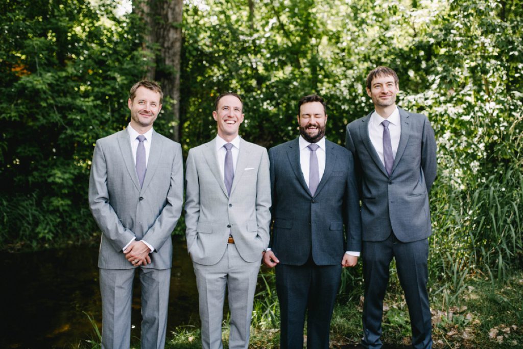 grooms laughing at lyons farmette wedding by austyn elizabeth photography