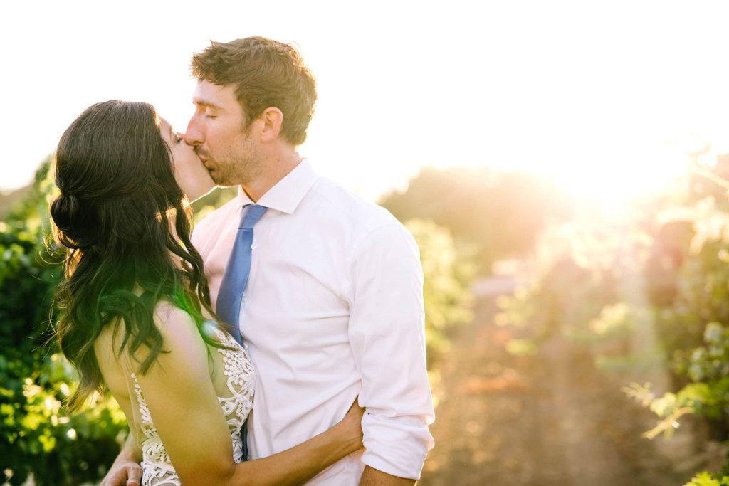 Bride and groom kiss in Paso Robles Vineyard at Cass Winery Wedding by Austyn Elizabeth