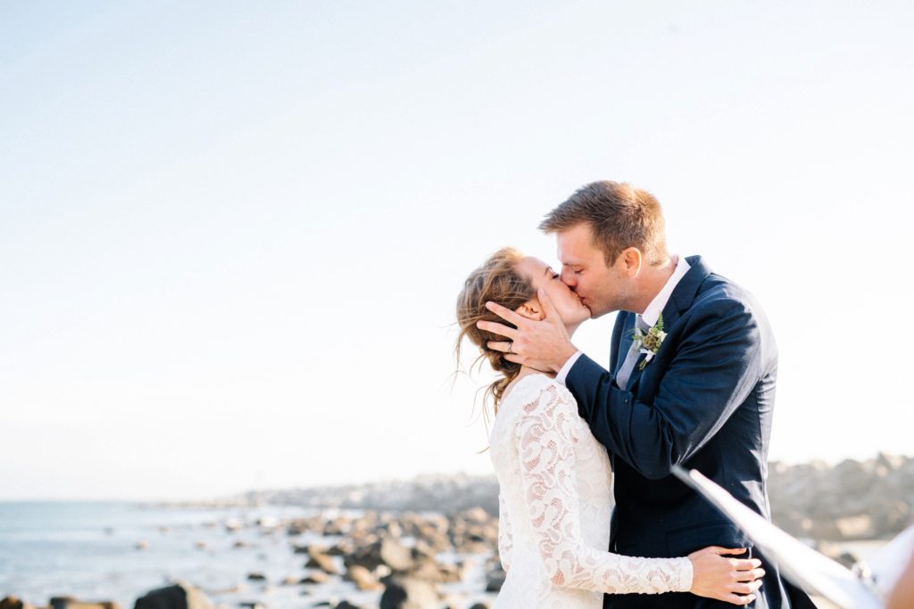 First kiss at a Morro Bay Wedding captured by San Luis Obispo Wedding Photographers Austyn Elizabeth Photography.