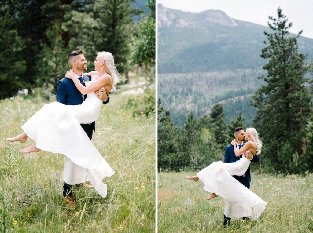 Groom holding bride in his arms in front of mountain at Estes Park Rocky Mountain Wedding by Della Terra Wedding Photographer Austyn Elizabeth Photography