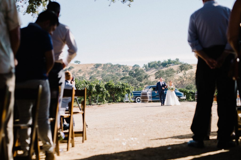 Bride walking down isle at Cass Winery Barrel House Wedding by Paso Wedding Photographer Austyn Elizabeth Photography