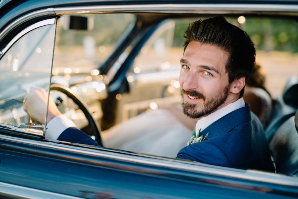 Groom driving away at Cass Winery Barrel House Wedding by Edna Valley Wedding Photographer Austyn Elizabeth Photography