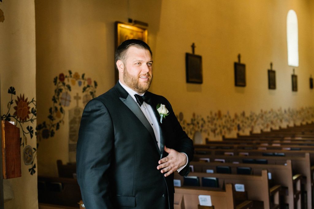 Groom welcoming guests at Mission de Tolosa Wedding photographed by San Luis Obispo Wedding Photographer Austyn Elizabeth Photography.