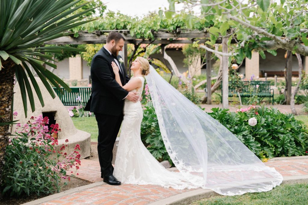 Bride and groom in garden of the  Mission de Tolosa Wedding photographed by Arroyo Grande Photographer Austyn Elizabeth Photography.