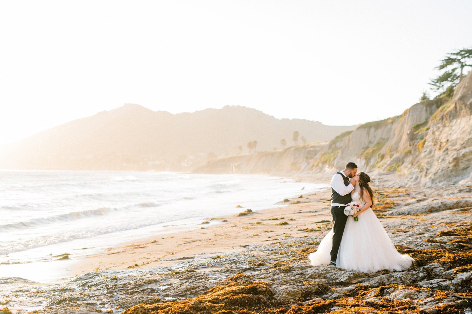 Bride and groom on beach at Sunset at Cliffs Hotel Wedding by Pismo Beach Wedding Photographer Austyn Elizabeth Photography