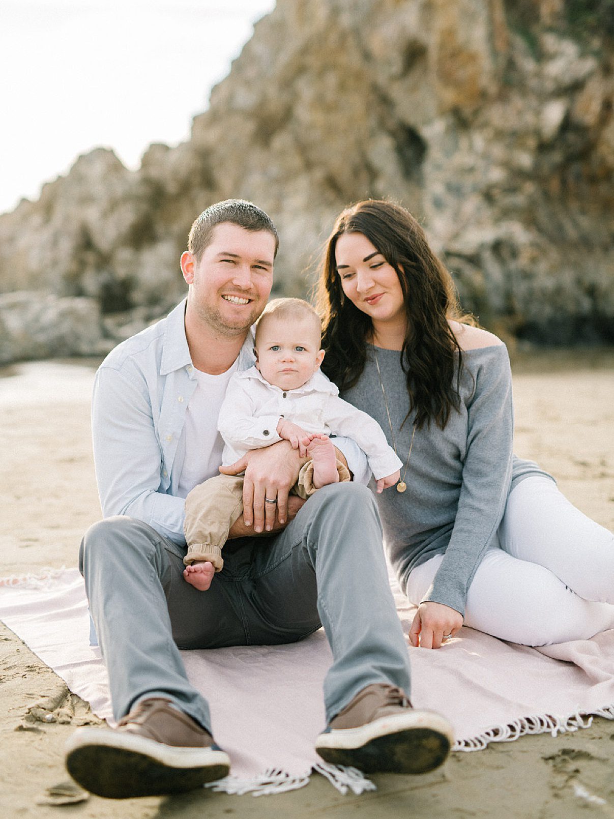 Cute little family of three wearing neutral grey tones at the beach with Pismo Beach Portrait Photographer Austyn Elizabeth Photography