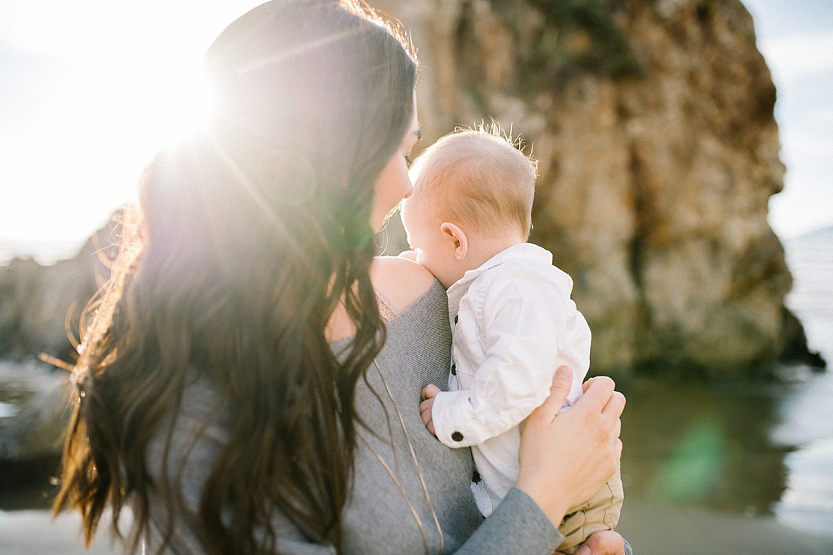 one year old snuggles at sunset beach photo session with Pismo Beach Family Photographer Austyn Elizabeth Photography