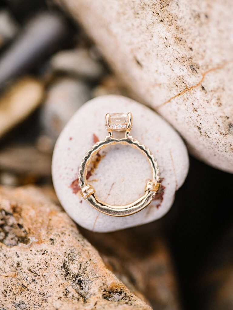Stunning engagement ring on rocks at Avila Beach engagement session by Avila Beach engagement photographer Austyn Elizabeth Photography