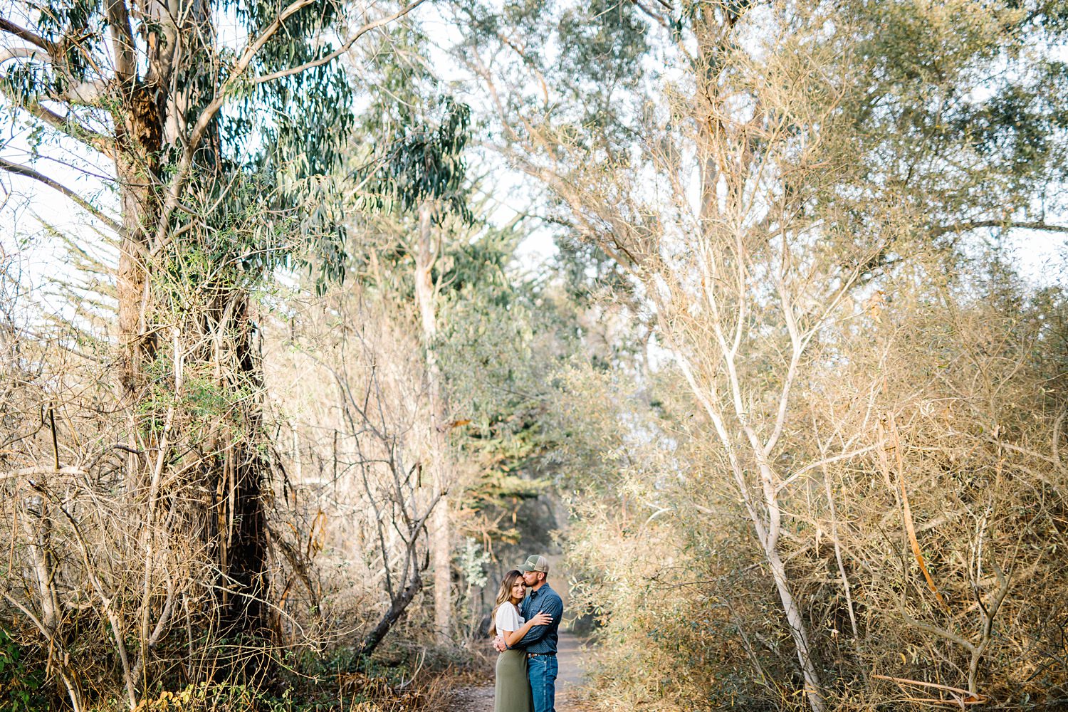 Butterfly grove engagement photo with all trees by Pismo Beach Engagement Photographer Austyn Elizabeth Photography