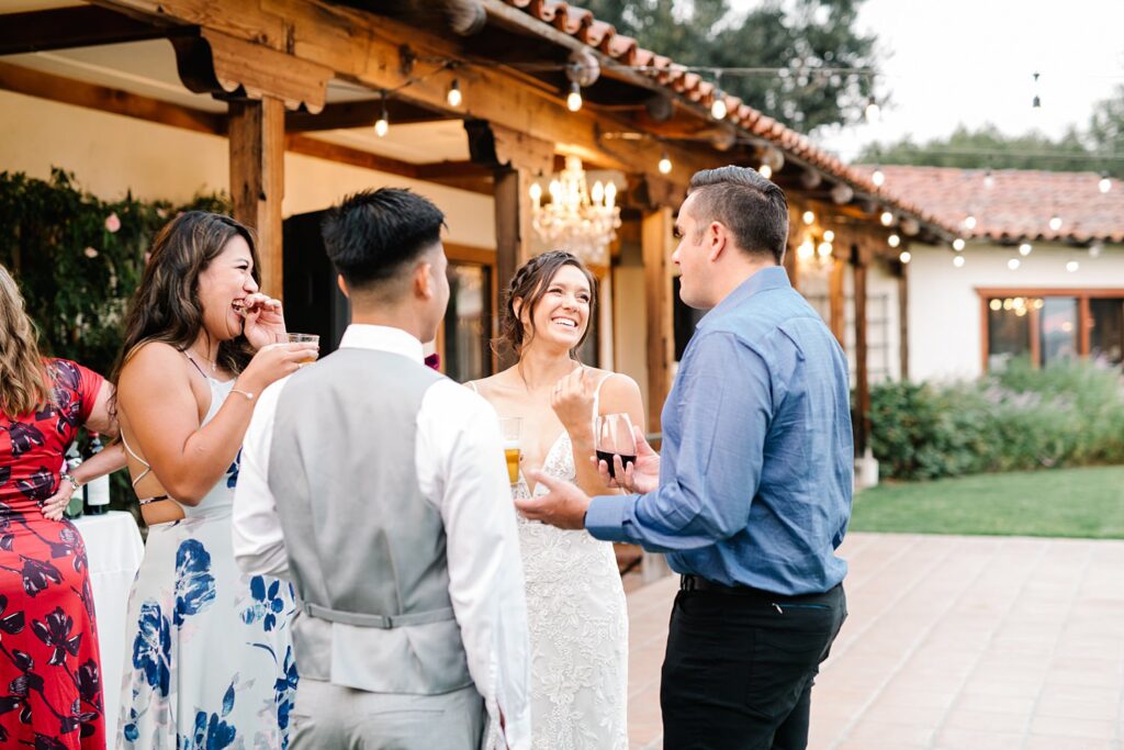 Guests laugh at The Casitas Estate Wedding by Arroyo Grande Wedding Photographer Austyn Elizabeth Photography
