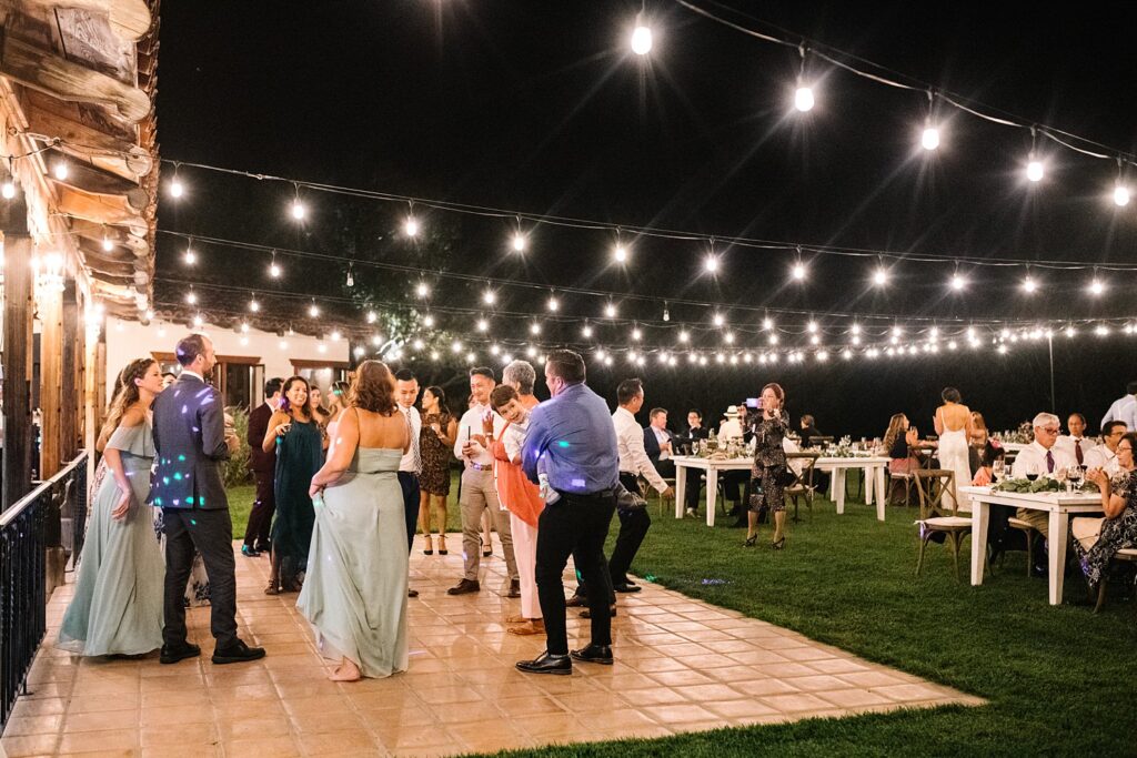 Dancing under stringed lights at The Casitas Estate Wedding by Arroyo Grande Wedding Photographer Austyn Elizabeth Photography