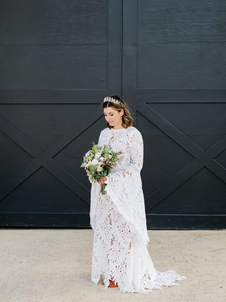 bohemian bride in front of black doors at La Lomita Ranch Wedding by Arroyo Grande Wedding Photographer Austyn Elizabeth Photography