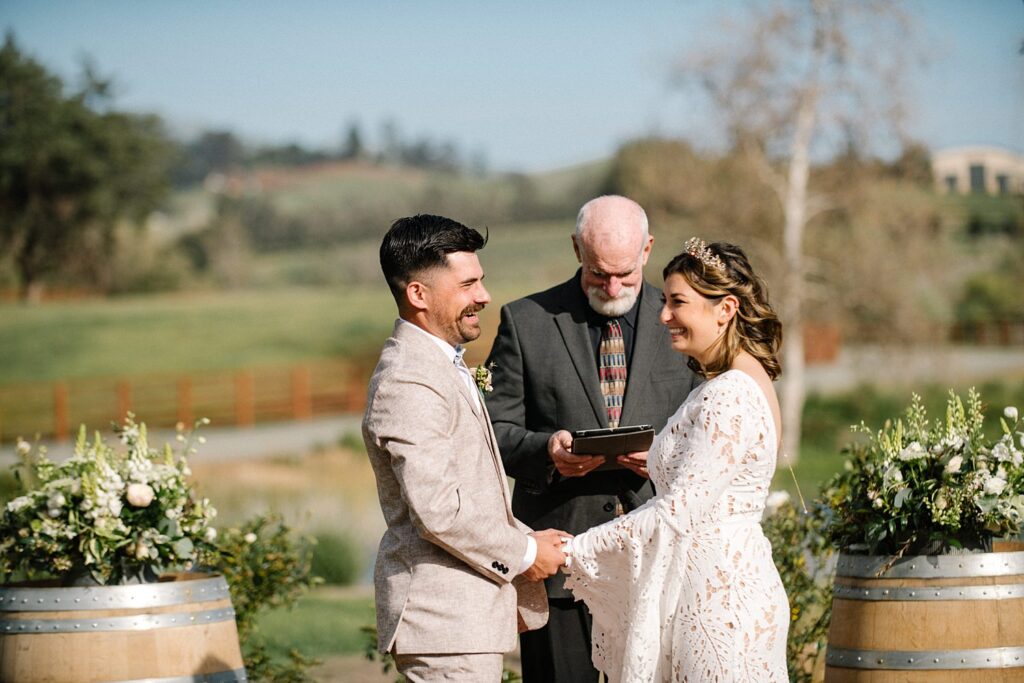 laughing during ceremony at La Lomita Ranch Wedding by Arroyo Grande Wedding Photographer Austyn Elizabeth Photography