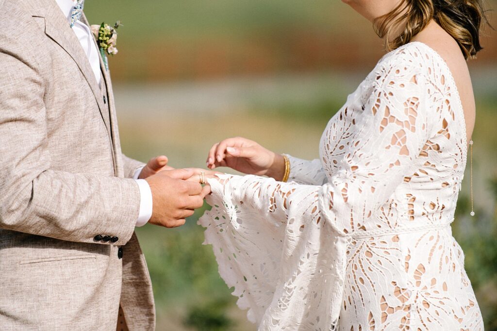 putting ring on brides finger at La Lomita Ranch Wedding by San Luis Obispo Wedding Photographer Austyn Elizabeth Photography