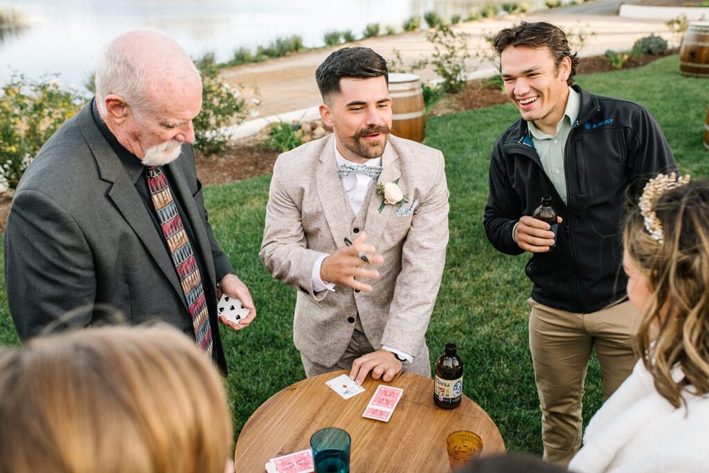Officiant gives magic card trick at La Lomita Ranch Wedding by SLO Wedding Photographer Austyn Elizabeth Photography