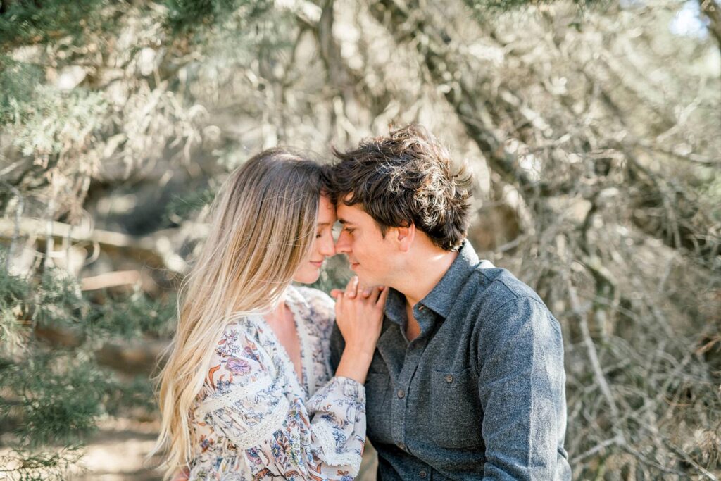 Cuddling in the brush at Bishops Peak Anniversary session by San Luis Obispo Wedding Photographer Austyn Elizabeth Photography
