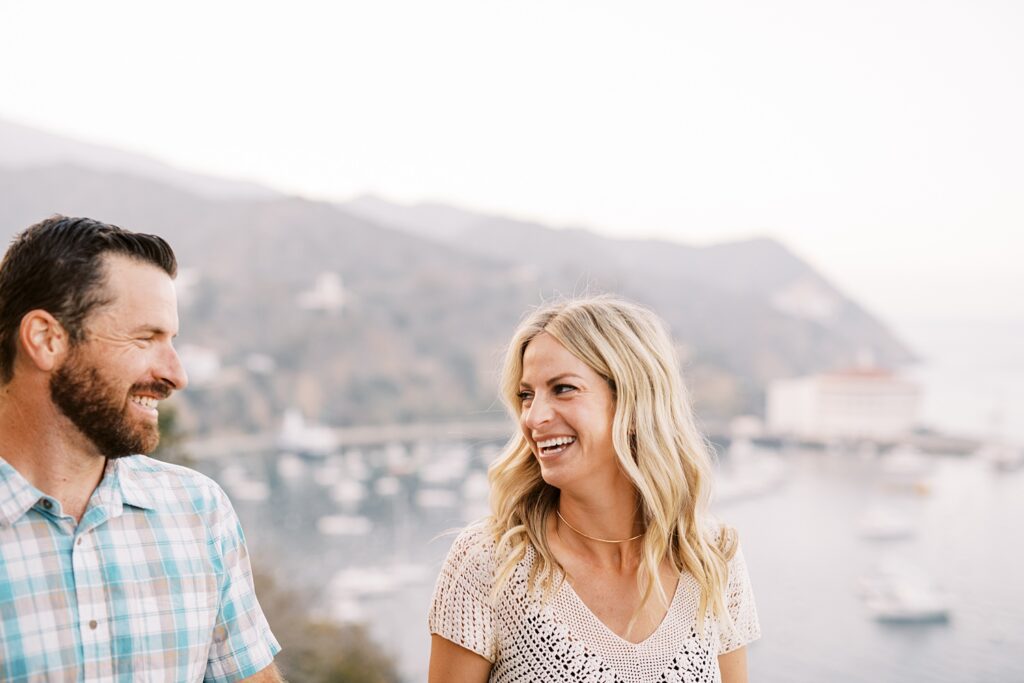 Couple laughing with Catalina Casino in the background by Avalon Wedding Photographer Austyn Elizabeth Photography