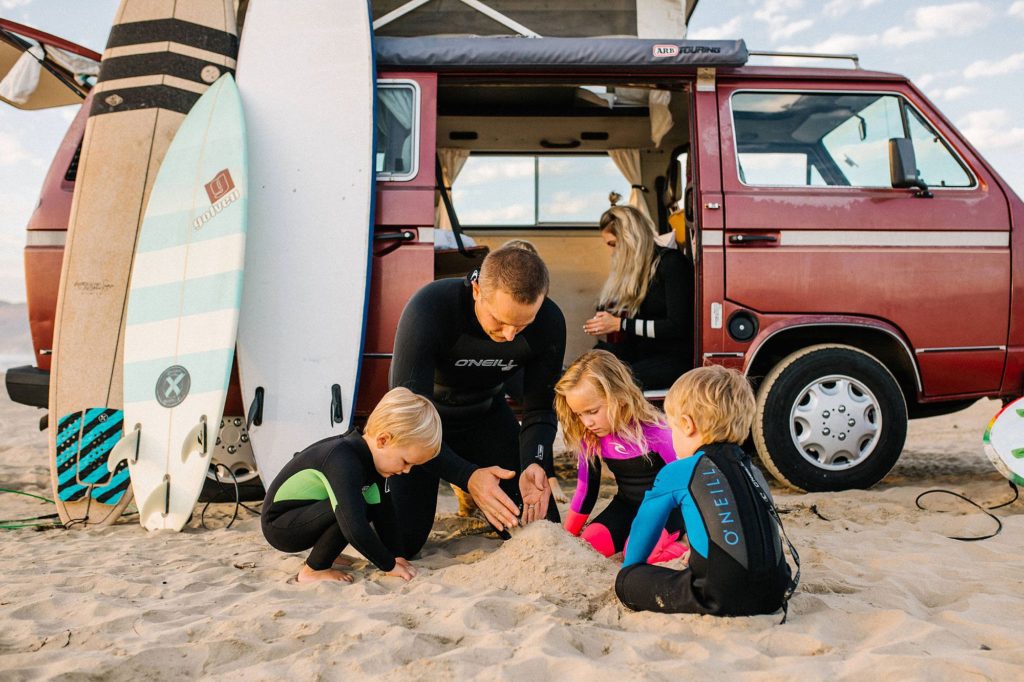 Family going surfing in Pismo Beach with VW Westfalia by Pismo Beach Family Photographer Austyn Elizabeth Photography