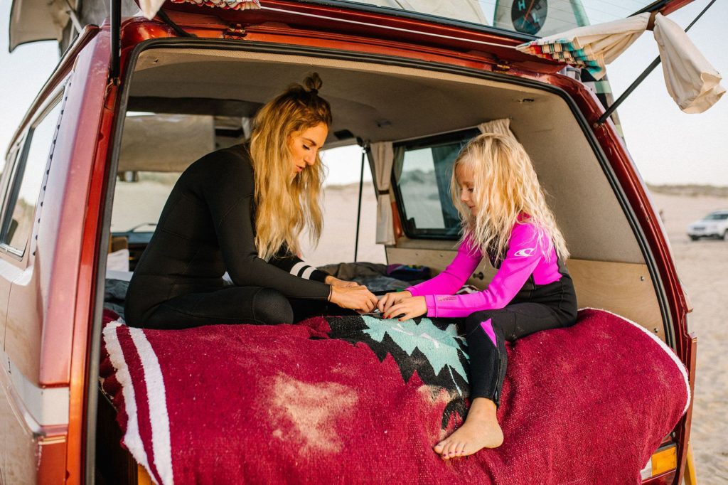 Family of six all piled up in VW Westfalia for Family adventure photo session with Pismo beach family photographer Austyn Elizabeth Photography