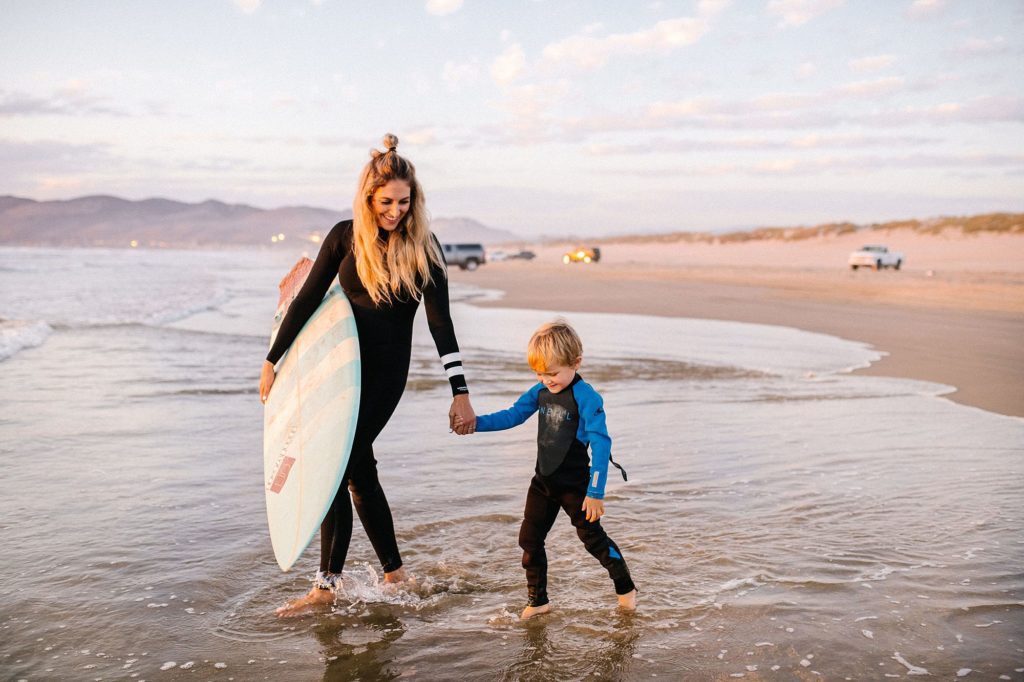 Surfing family at Pismo Beach during sunset by Pismo Beach Family photographer Austyn Elizabeth Photography