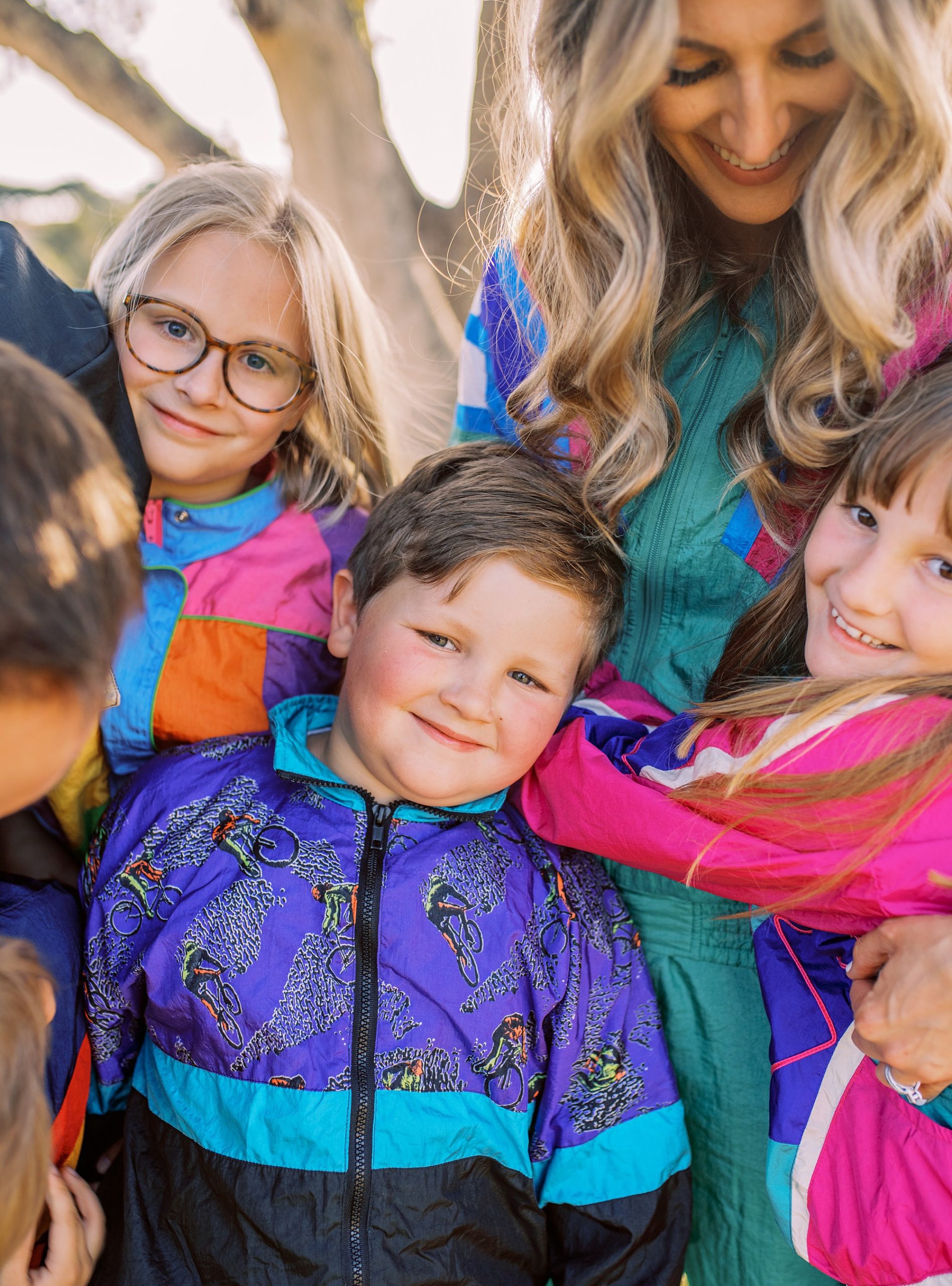 Family in retro windbreakers for family photo shoot with Pismo Beach Family Photographer Austyn Elizabeth Photography