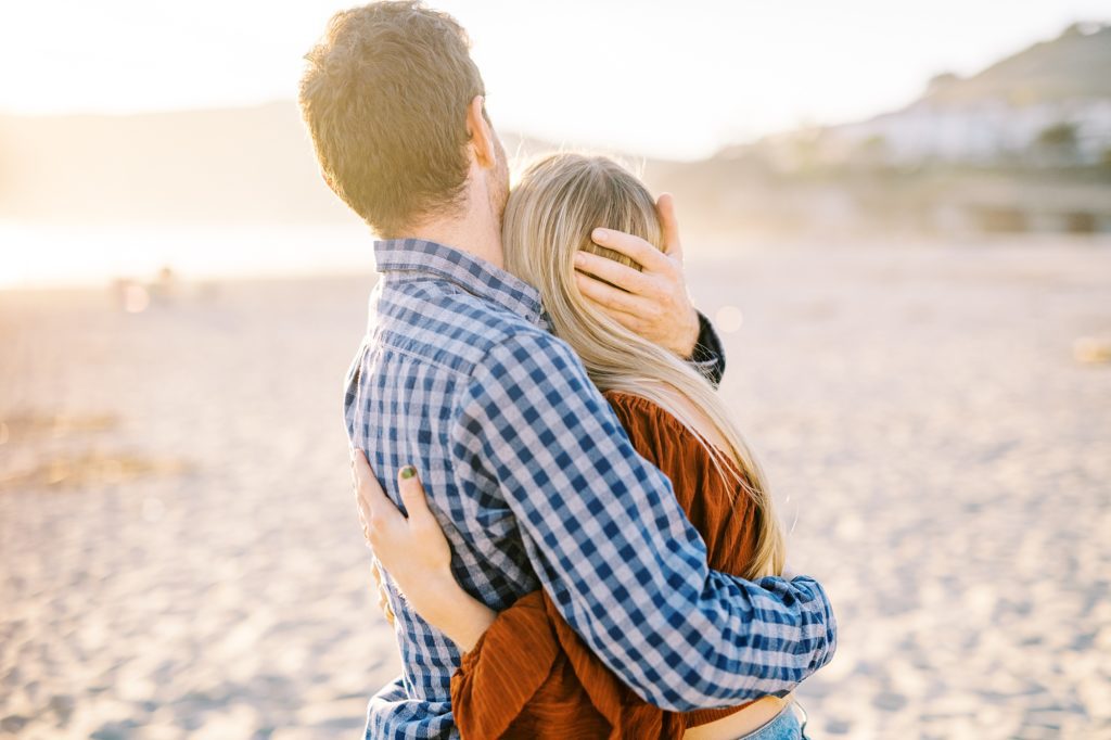 Boyfriend hugs fiance during Avila Beach Proposal by Avila Beach Wedding Photographer Austyn Elizabeth Photography