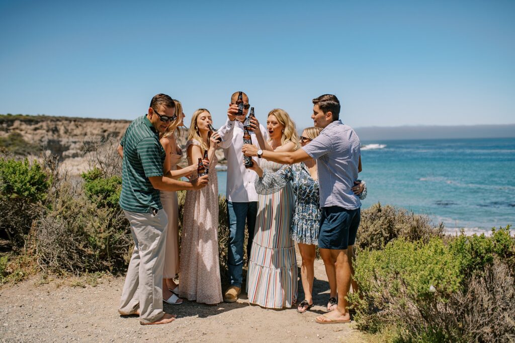 805 toasts at surprise proposal at Montana De Oro's Spooners Cove by Pismo beach engagement photographer austyn elizabeth photography