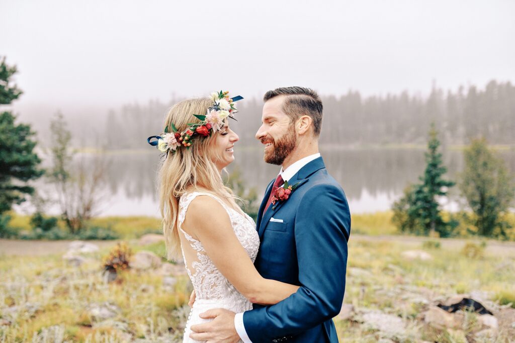 Couple laughing at Sprague Lake at Destination Rocky Mountain National Forest Wedding by Estes park Wedding Photographer Austyn Elizabeth Photography