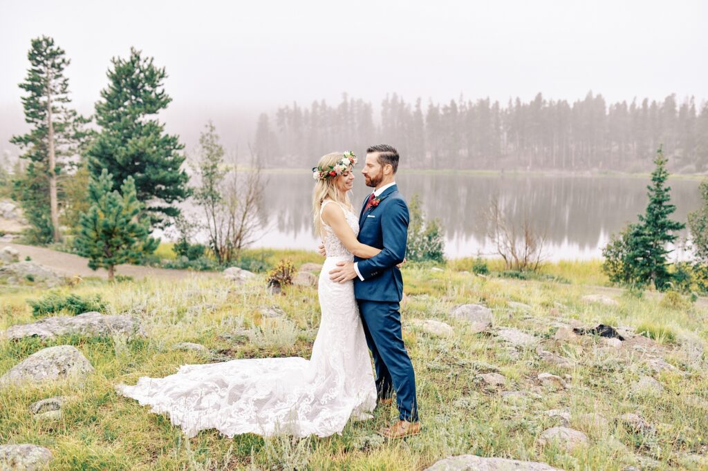Bride with floral crown at Sprague Lake at Destination Rocky Mountain National Forest Wedding by Estes park Wedding Photographer Austyn Elizabeth Photography