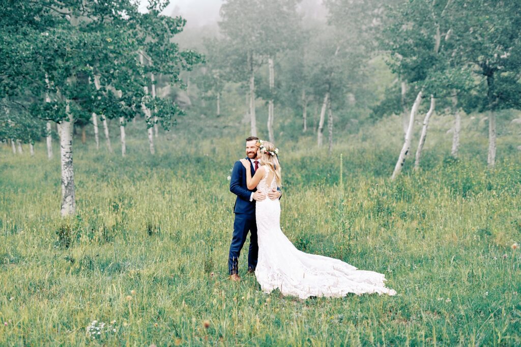 Couple stand besides aspens Destination Rocky Mountain National Forest Wedding by Estes park Wedding Photographer Austyn Elizabeth Photography