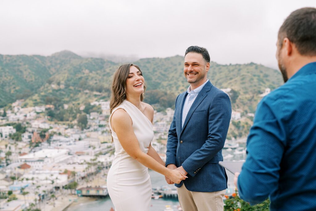 Couple giggle during their ceremony at Catalina island Elopement during a foggy spring day by Catalina Wedding Photographer Austyn Elizabeth Photography