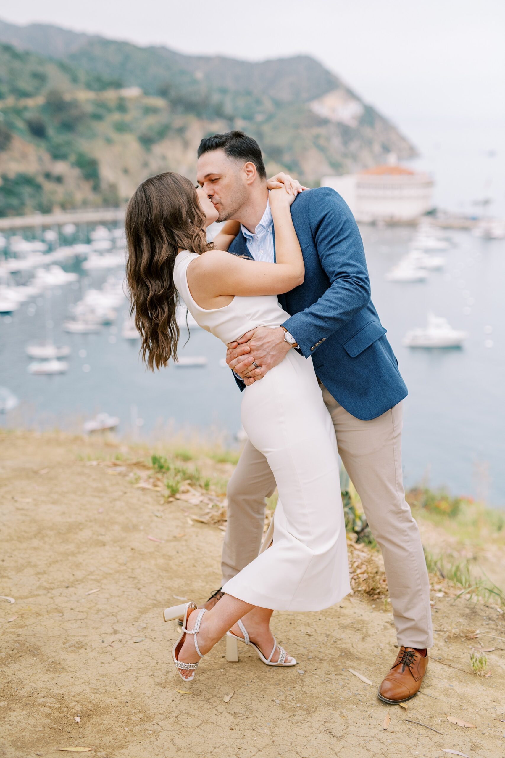 Couple dips and kisses across from the Casino and Avalon bay by Catalina Island Wedding Photographer Austyn Elizabeth Photography
